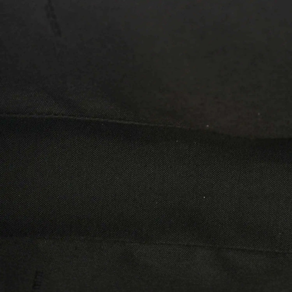Fendi baguette bag lining close-up in dark fabric with subtle texture