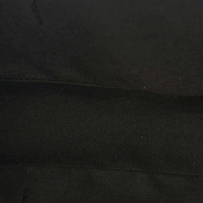 Fendi baguette bag lining close-up in dark fabric with subtle texture