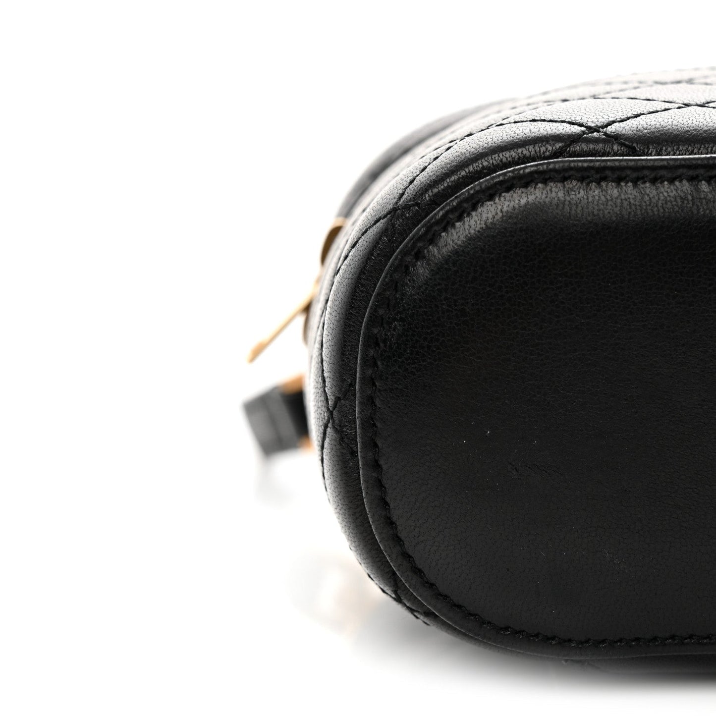 Black lambskin quilted mini vanity case with rounded edge and contrast stitching
