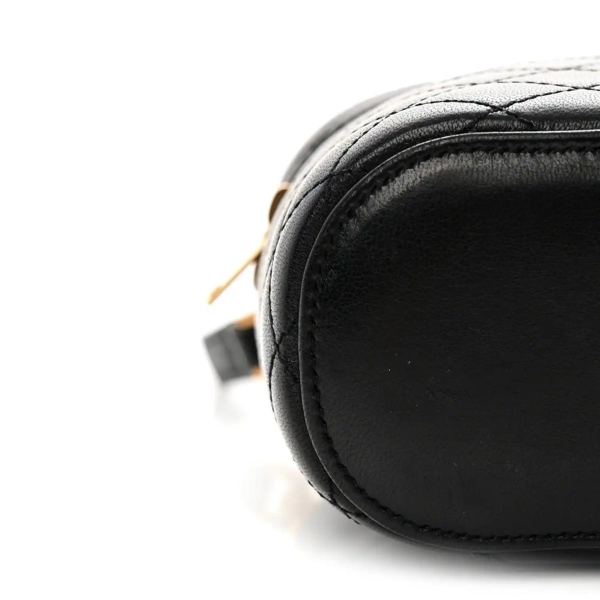 Black lambskin quilted mini vanity case with rounded edge and contrast stitching