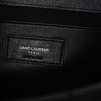 Black leather satchel interior label patch reading SAINT LAURENT PARIS