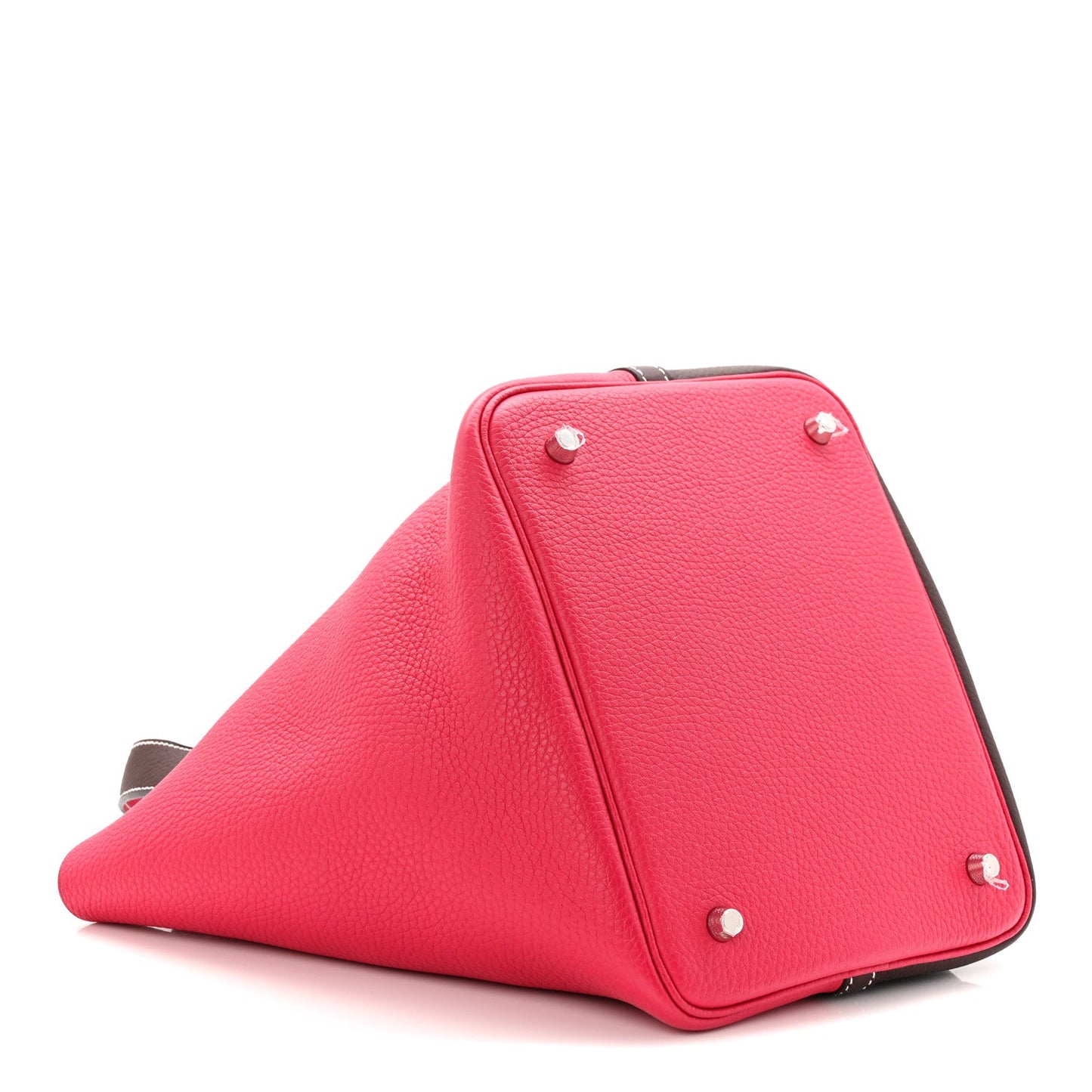 Two-tone bucket bag in bright red with dark brown trim and silver-tone corner studs