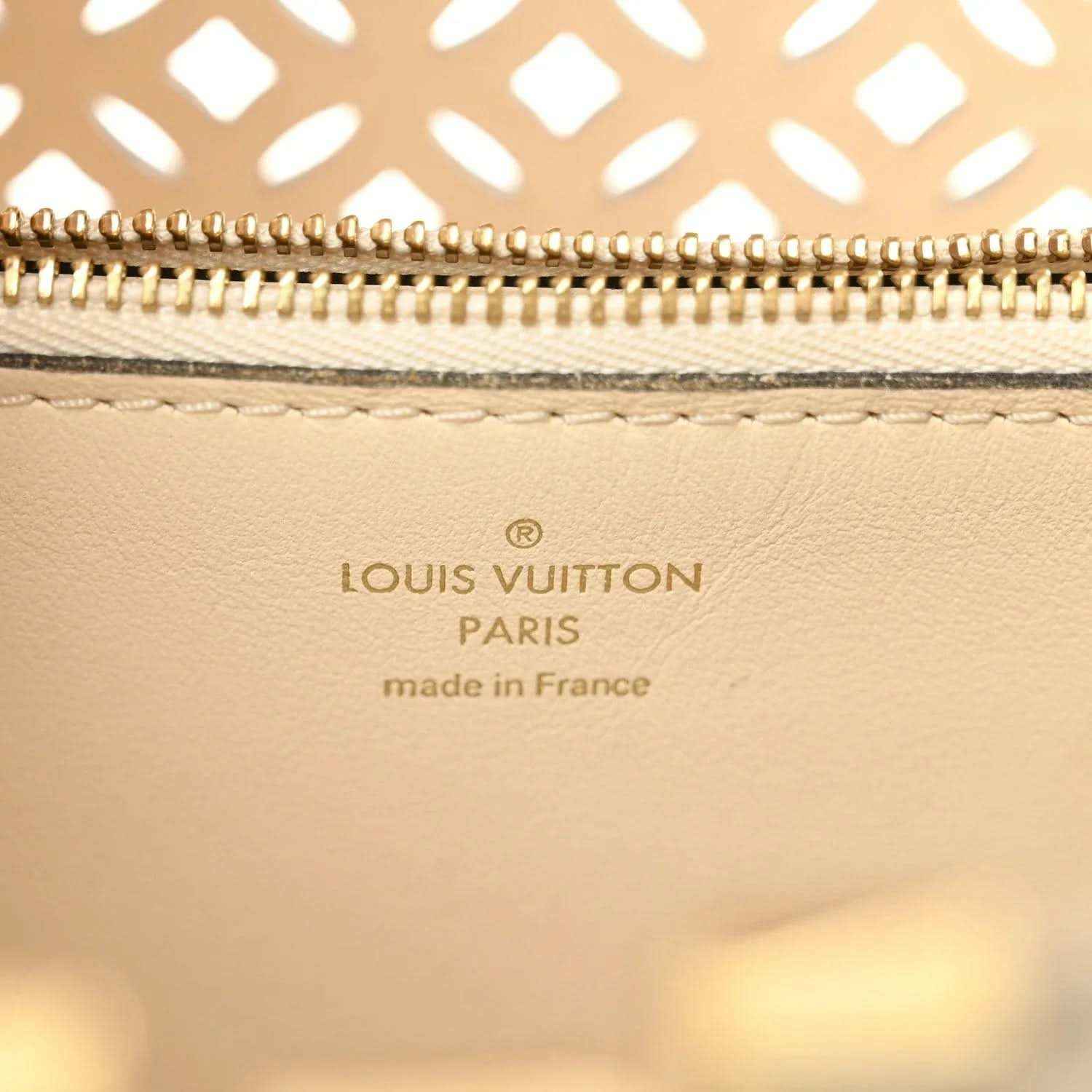 Louis Vuitton handbag interior leather stamp with gold zipper trim