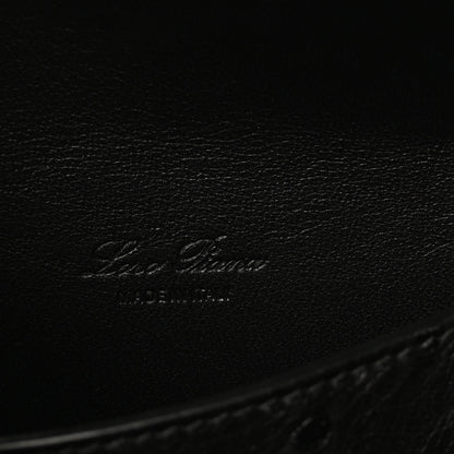 Black ostrich leather with embossed Loro Piana logo on inner base.