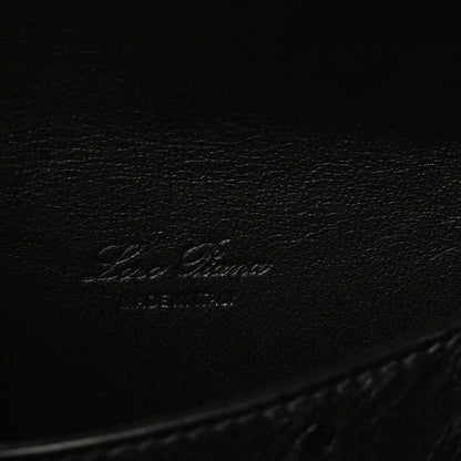 Black ostrich leather with embossed Loro Piana logo on inner base.