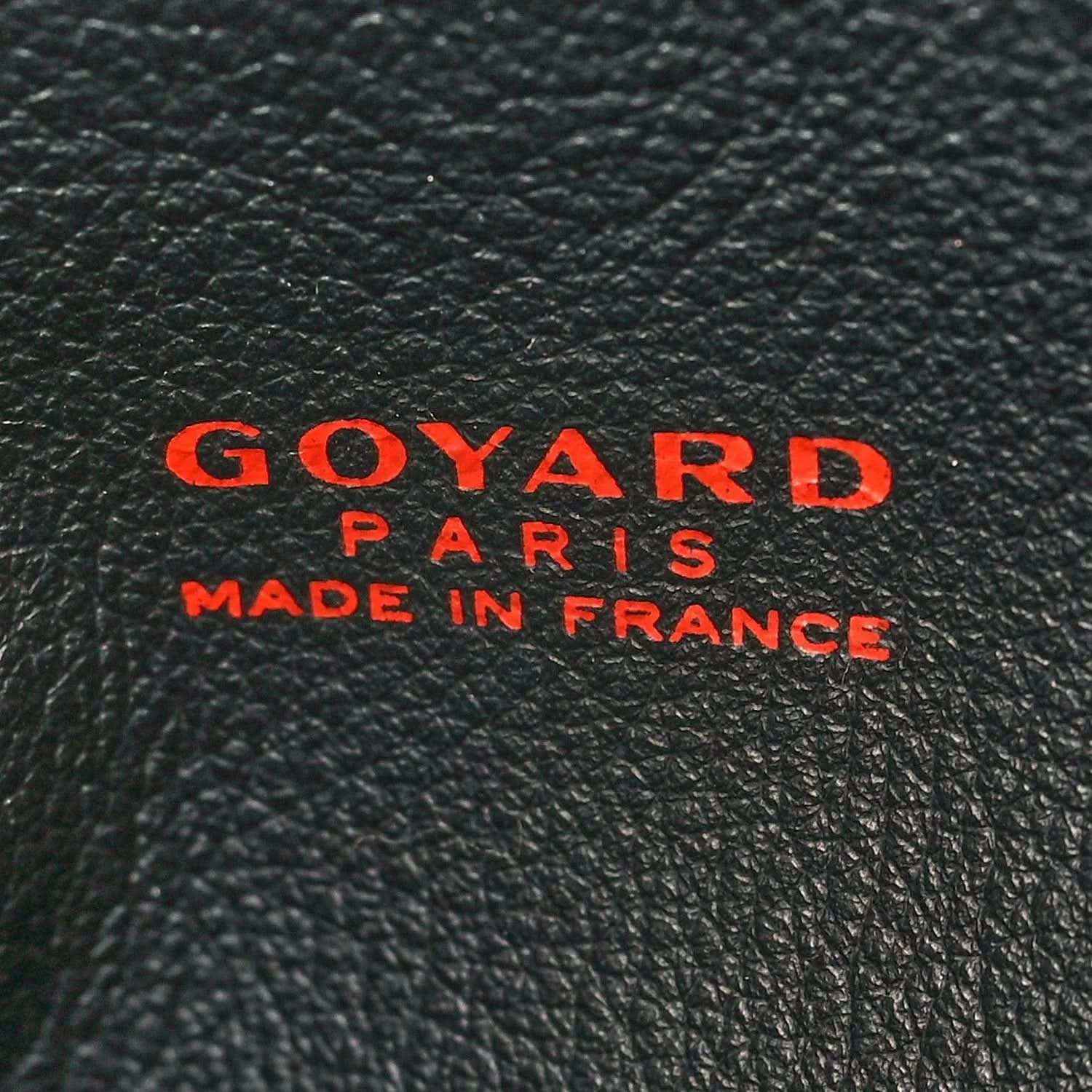 Goyard tote bag branding on black leather, red Goyard Paris and Made in France text