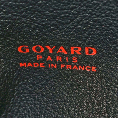 Goyard tote bag branding on black leather, red Goyard Paris and Made in France text