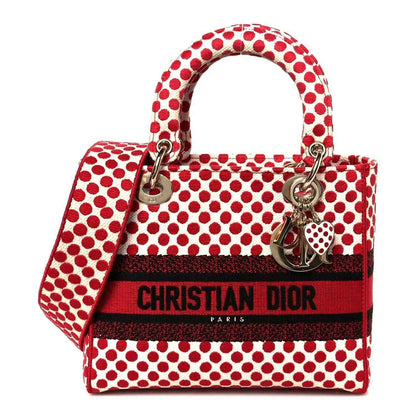 Medium polka dot canvas bag in red and white with top handles and heart charm