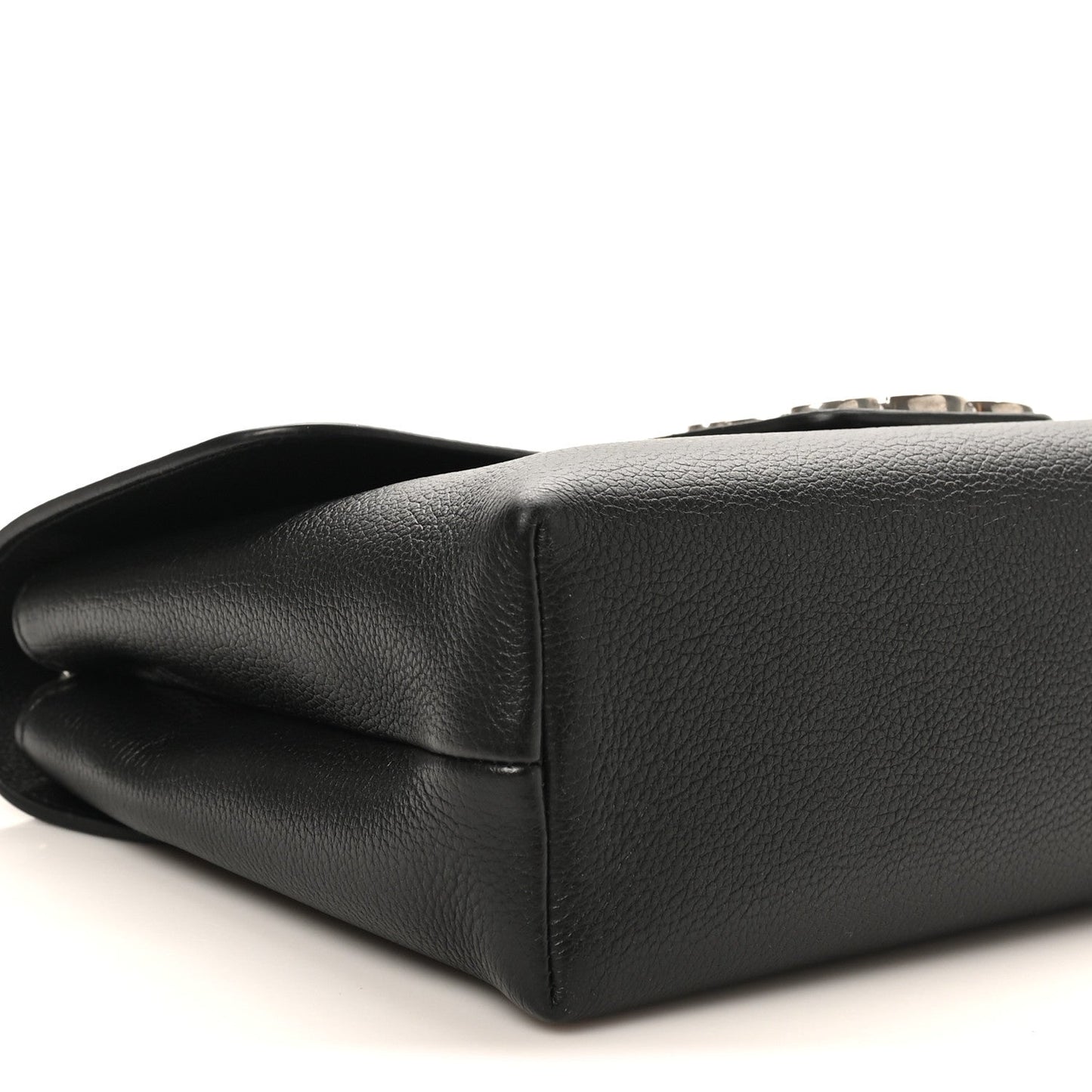 Black calfskin bag bottom corner with smooth leather edge