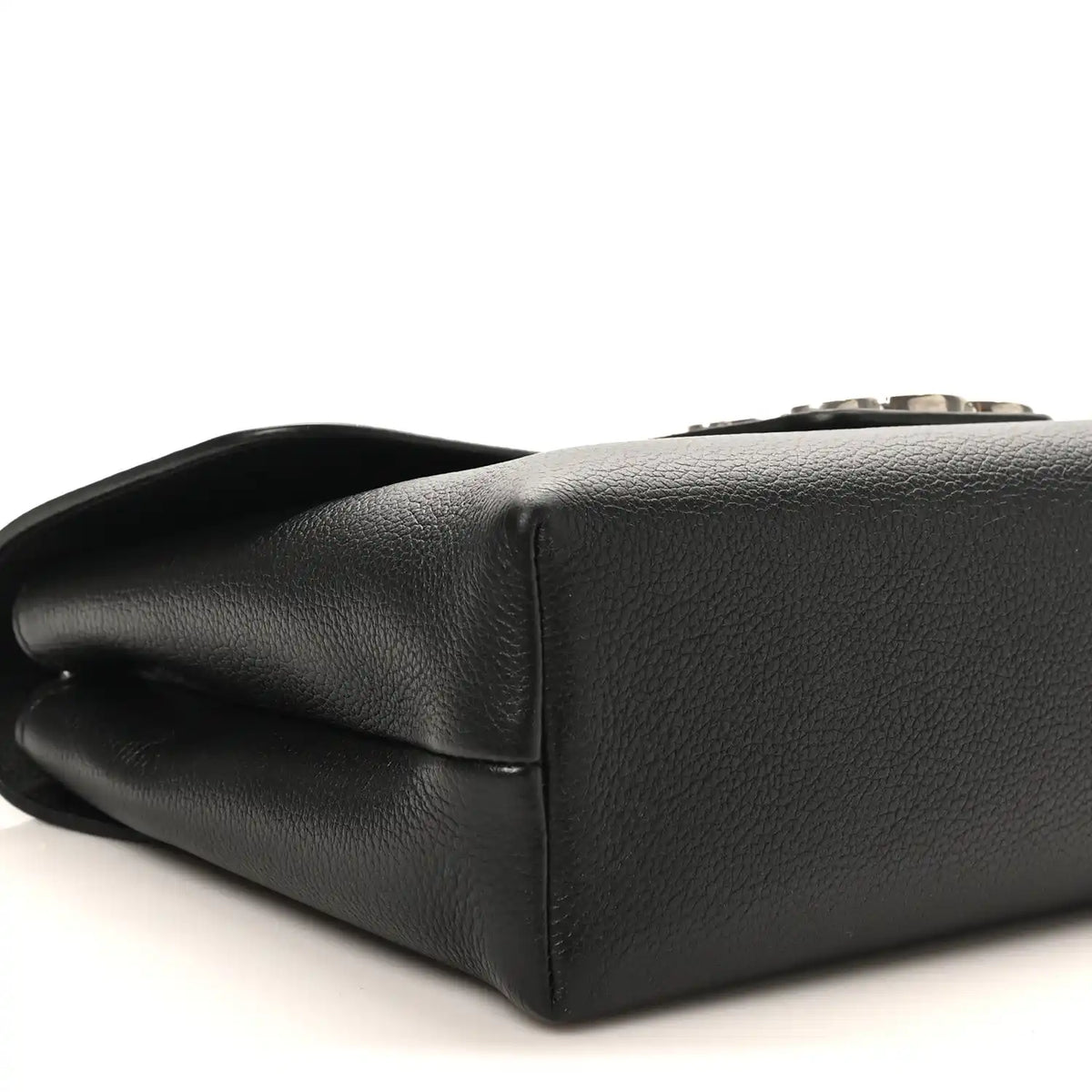 Black calfskin bag bottom corner with smooth leather edge