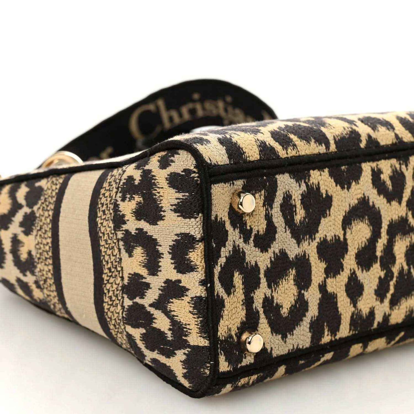Christian Dior leopard canvas bag corner with black piping and metal stud