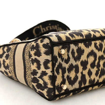 Christian Dior leopard canvas bag corner with black piping and metal stud
