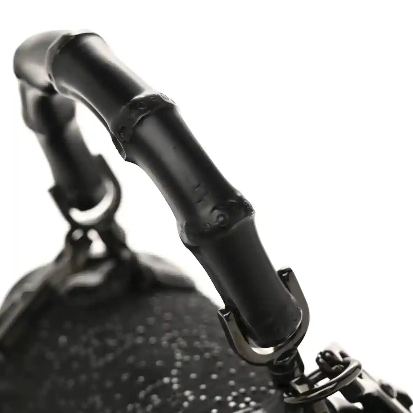 Black mini bag with bamboo handle and textured monogram fabric