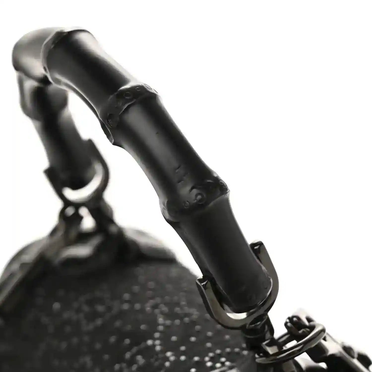Black mini bag with bamboo handle and textured monogram fabric