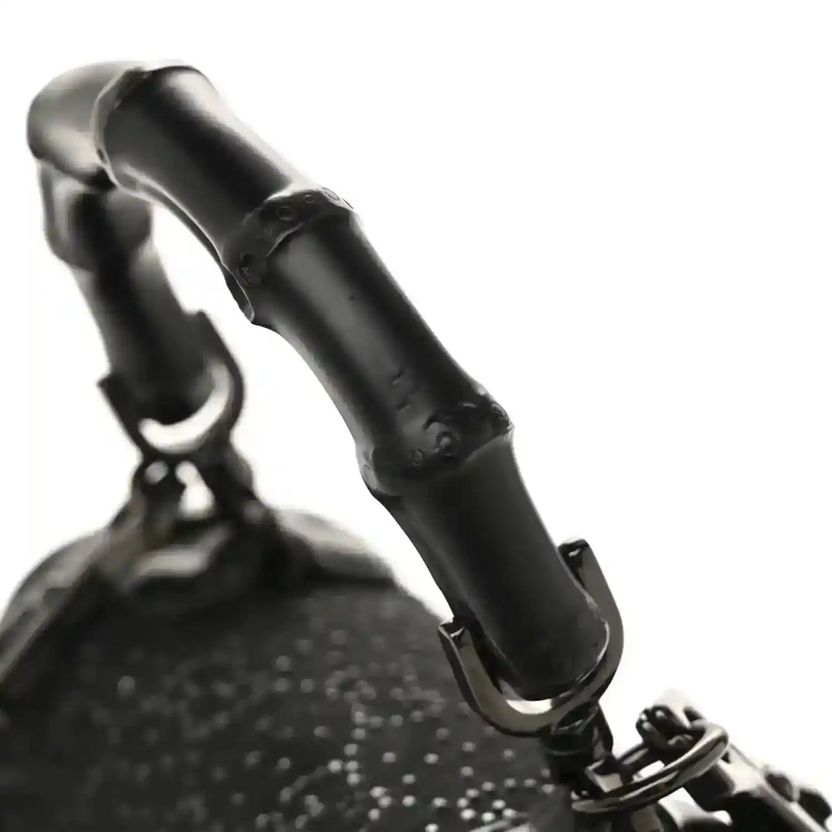 Black mini bag with bamboo handle and textured monogram fabric
