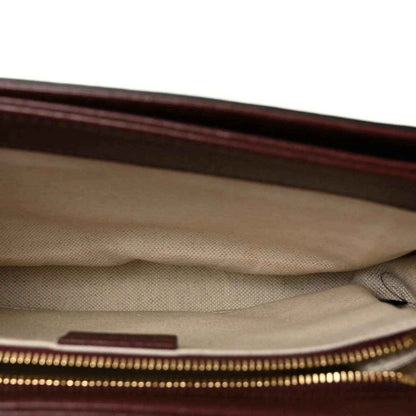 Gucci shoulder bag interior view with beige fabric lining and gold-tone zipper detail