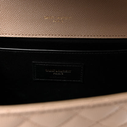 Dark lining interior of satchel with embossed brand patch label in a beige outer frame.