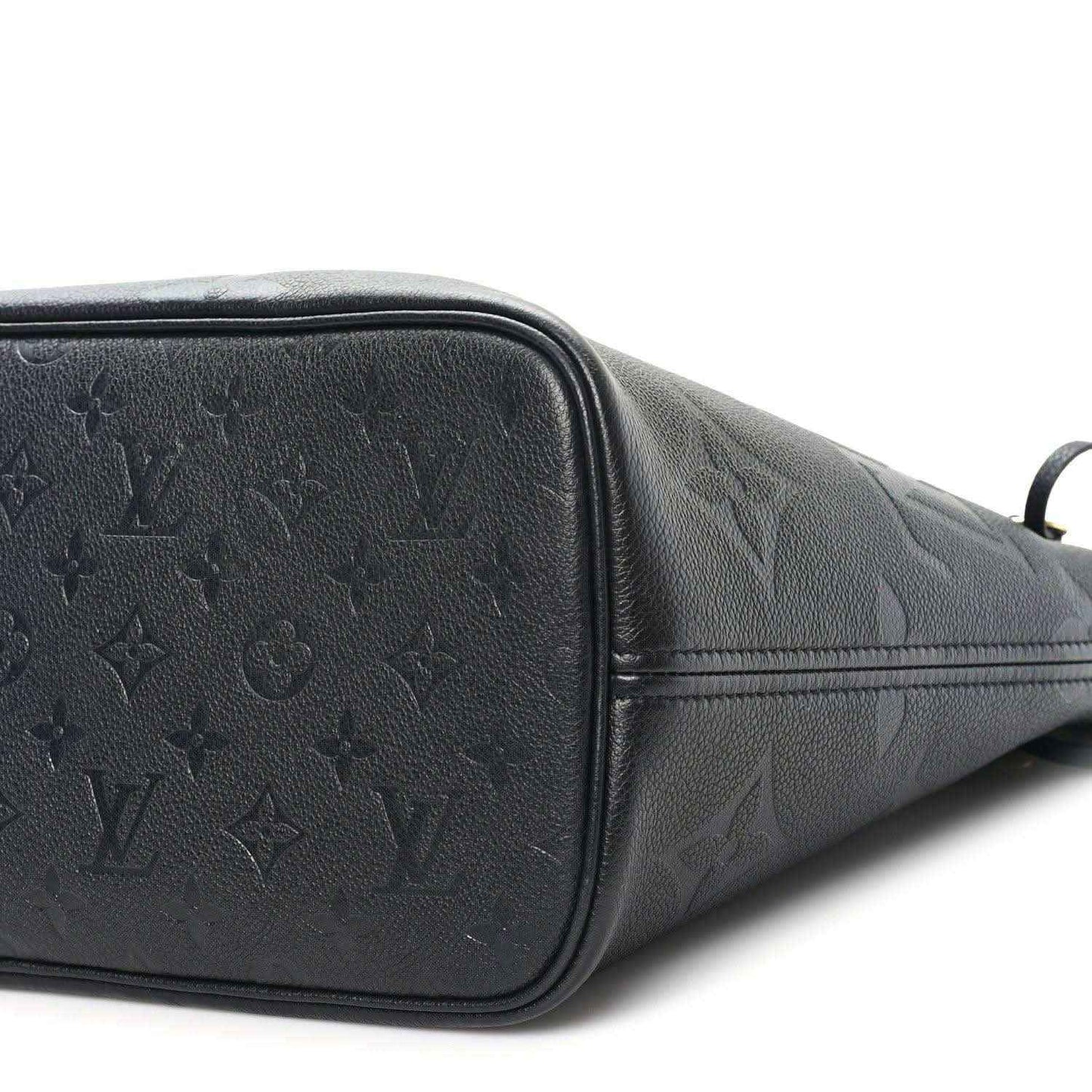 Neverfull MM tote bag end panel, dark black embossed monogram leather and zipper edge