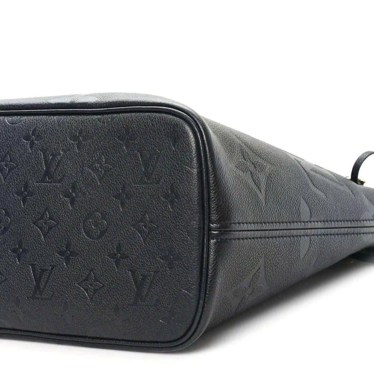 Neverfull MM tote bag end panel, dark black embossed monogram leather and zipper edge