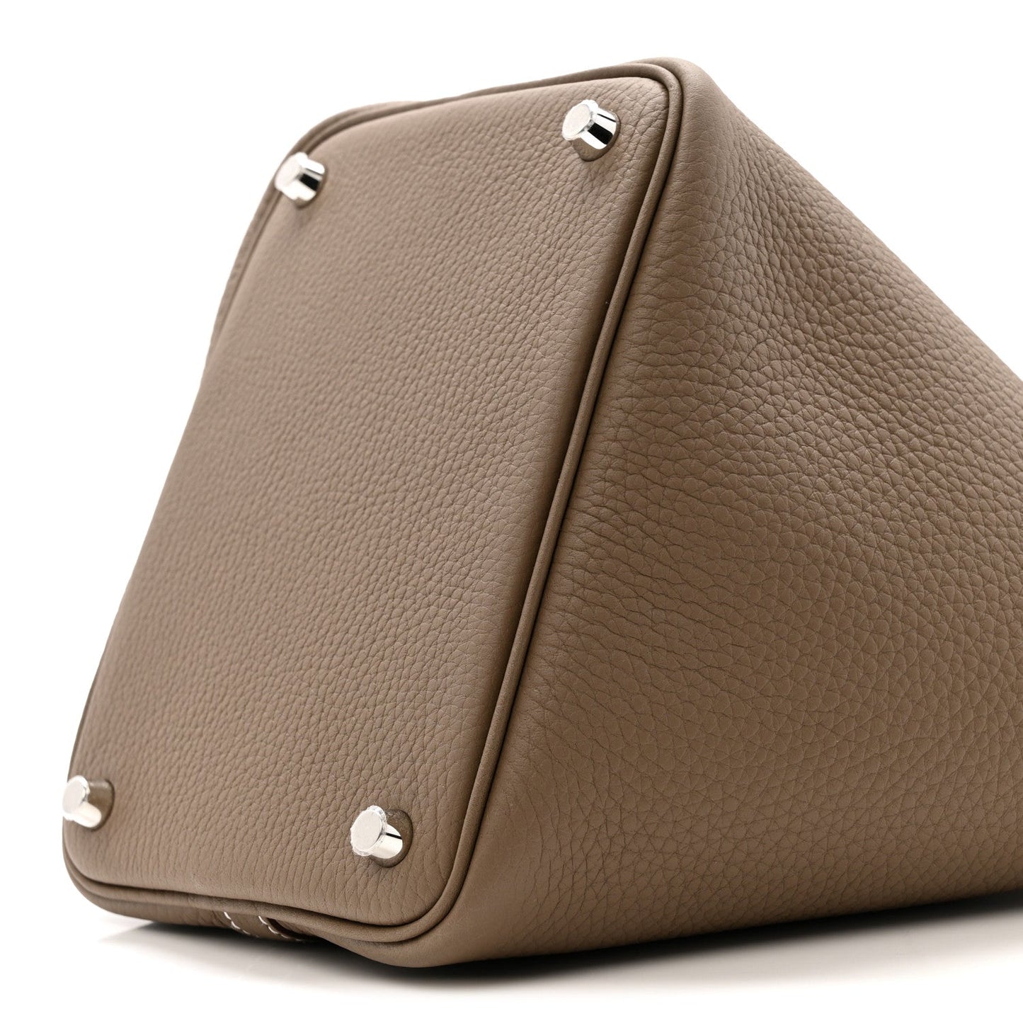 Etoupe leather bag corner with three metal feet and stitched edge