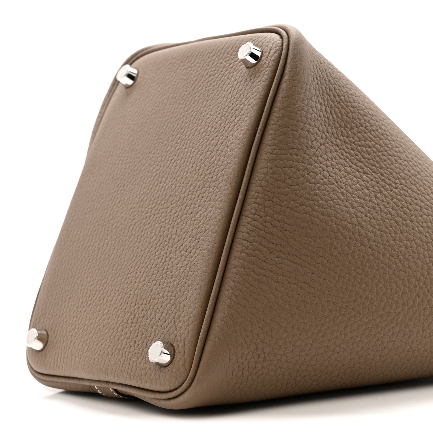 Etoupe leather bag corner with three metal feet and stitched edge