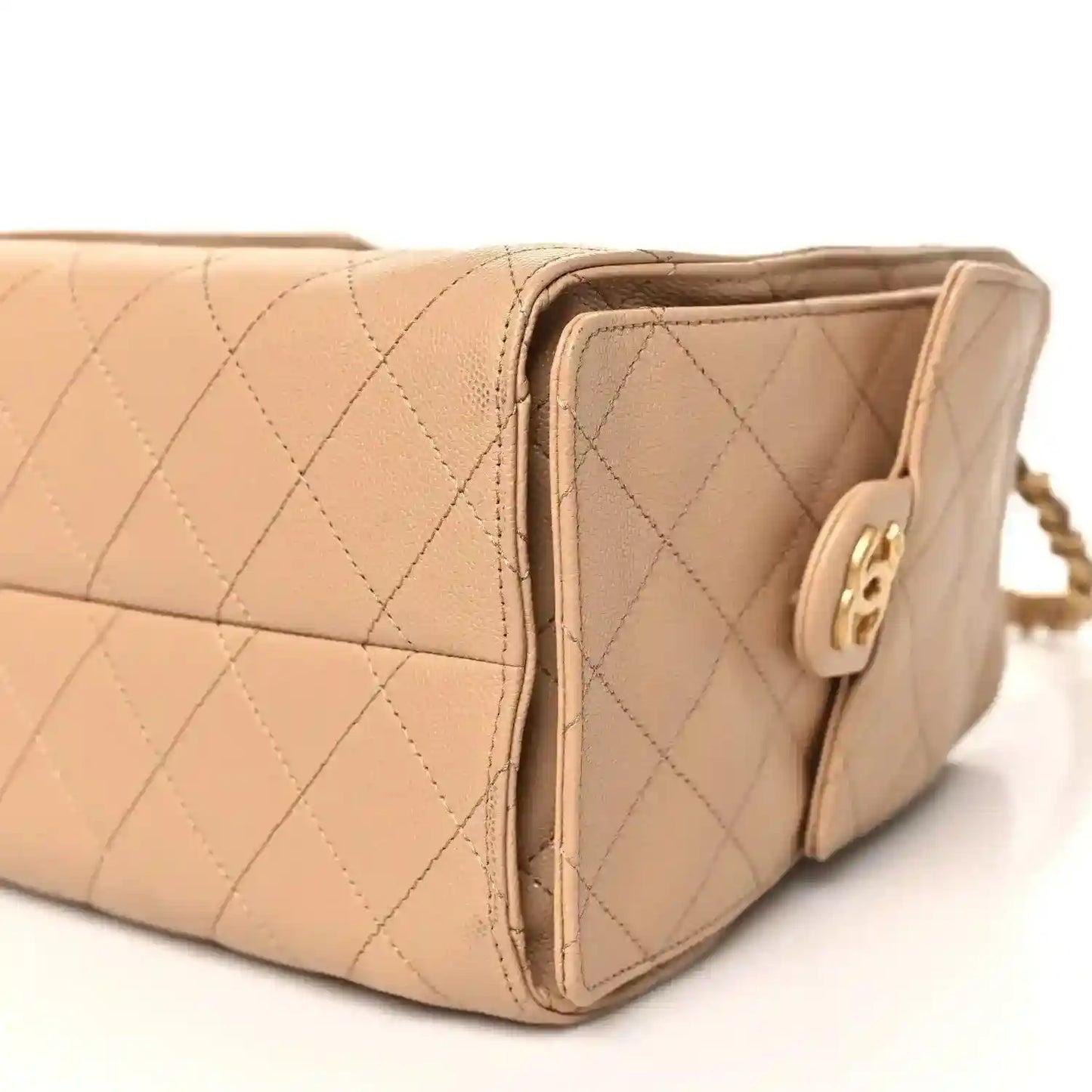 Chanel caviar quilted small 25 handbag side view in dark beige with gold logo hardware