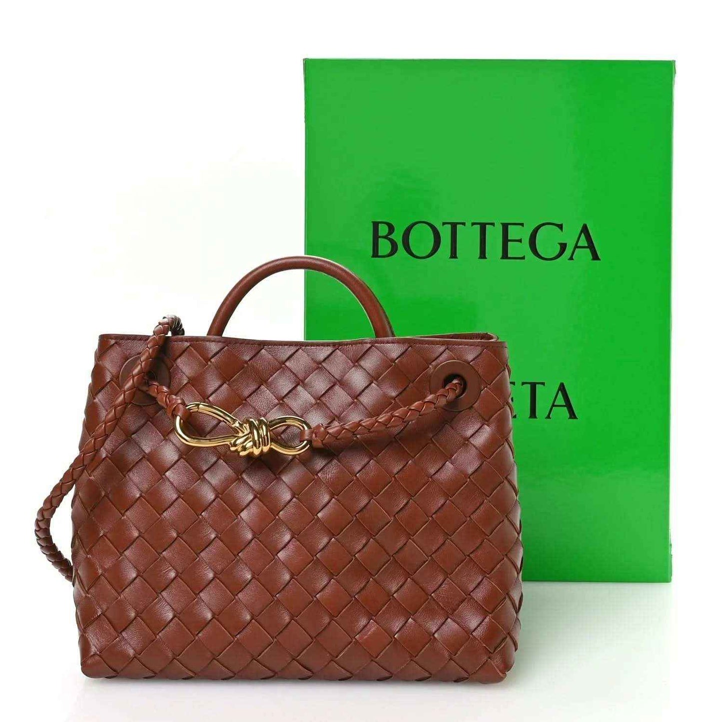 Small woven leather bag in Sapele brown with gold clasp, top handle, and drawstring