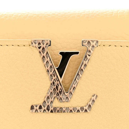 Louis Vuitton Mini Capucines handbag with V logo in snakeskin trim, beige