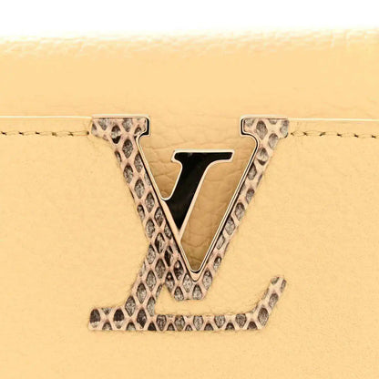 Louis Vuitton Mini Capucines handbag with V logo in snakeskin trim, beige