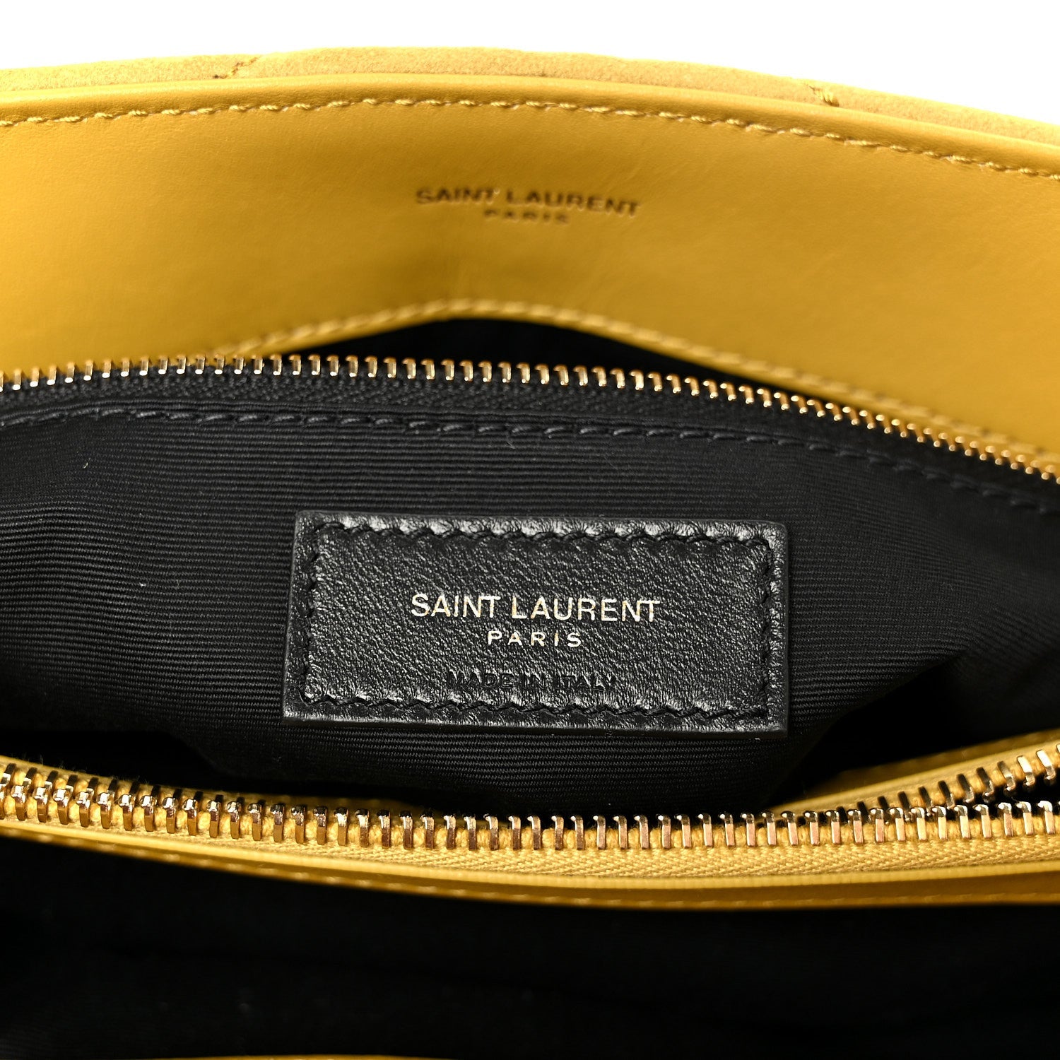 Black fabric interior label pocket with “SAINT LAURENT PARIS” under zipper