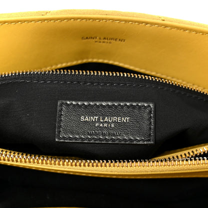 Black fabric interior label pocket with “SAINT LAURENT PARIS” under zipper