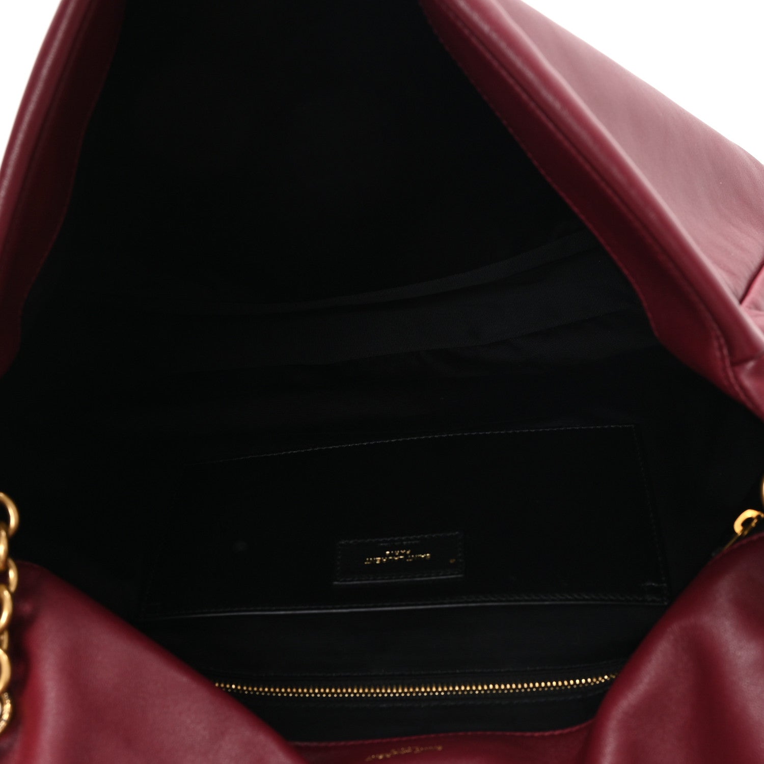 Dark bordeaux lambskin shoulder bag interior with black lining and zip pocket