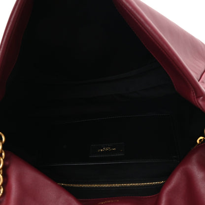 Dark bordeaux lambskin shoulder bag interior with black lining and zip pocket