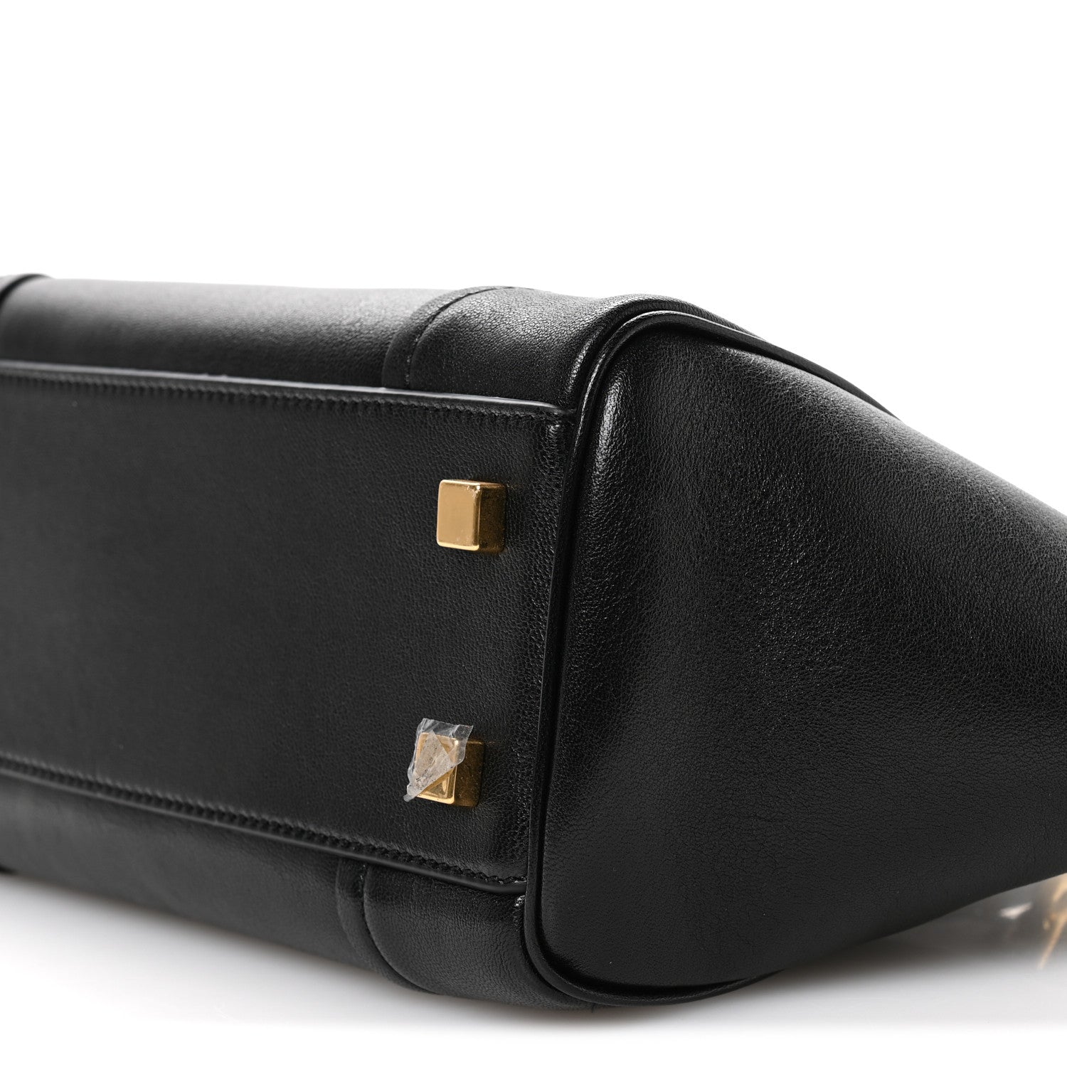 Celine black leather mini tote end panel close-up with gold-tone hardware