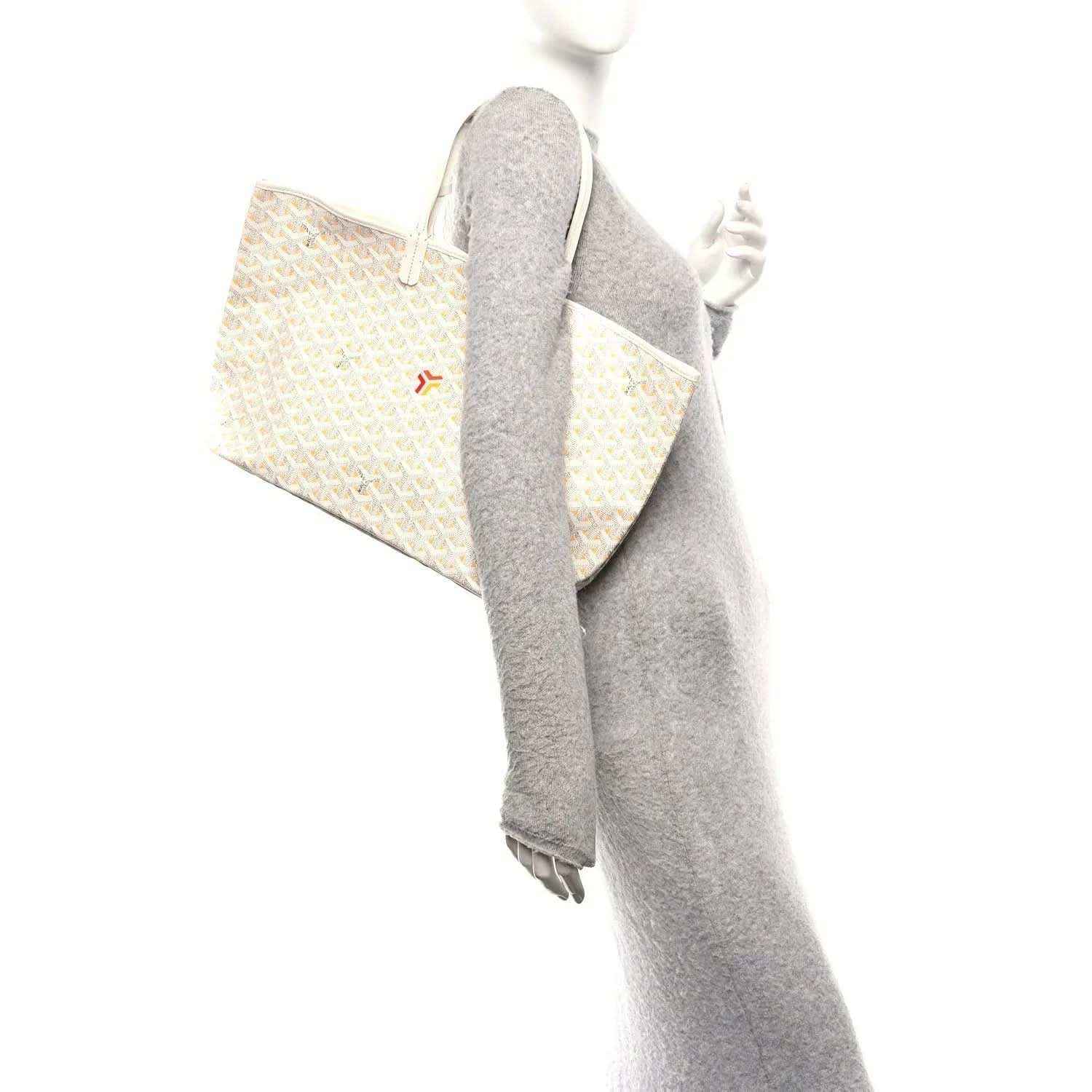 White and yellow patterned tote bag with long handles, side view