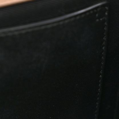 Black fabric lining interior panel with stitched edge