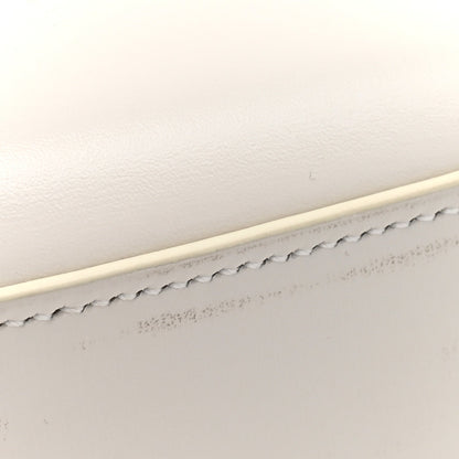 Shiny calfskin shoulder bag top edge with scalloped trim and stitching