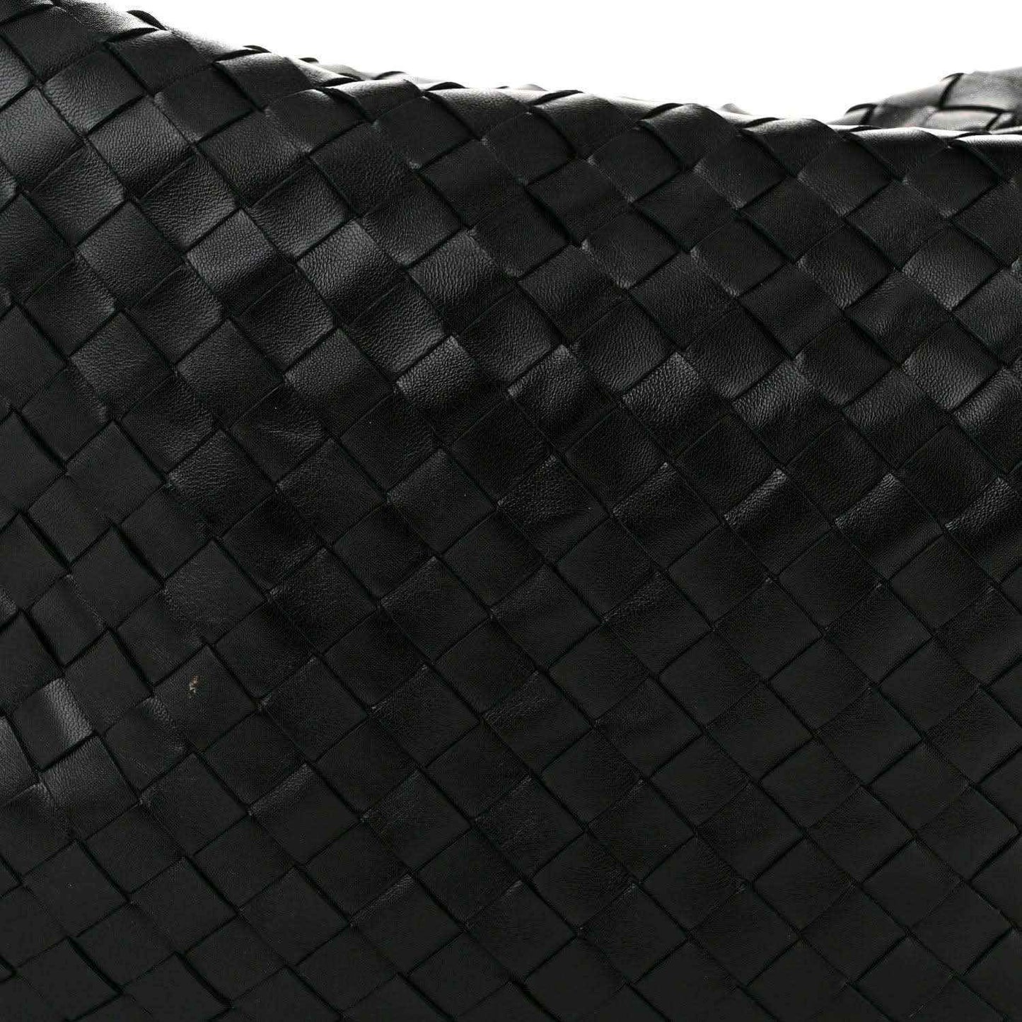 Black woven leather bag panel with intrecciato square pattern