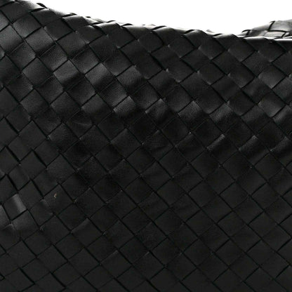 Black woven leather bag panel with intrecciato square pattern