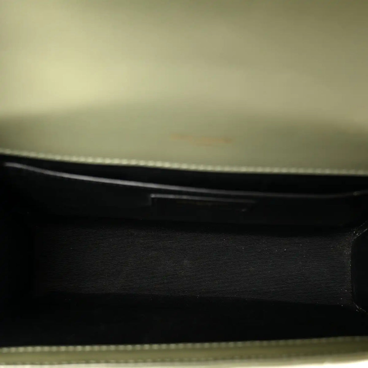 Dark leather satchel interior lining with zipper edge detail