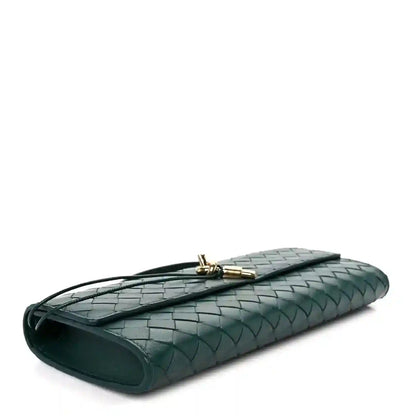 Emerald green intrecciato nappa long clutch bag side view with gold clasp hardware