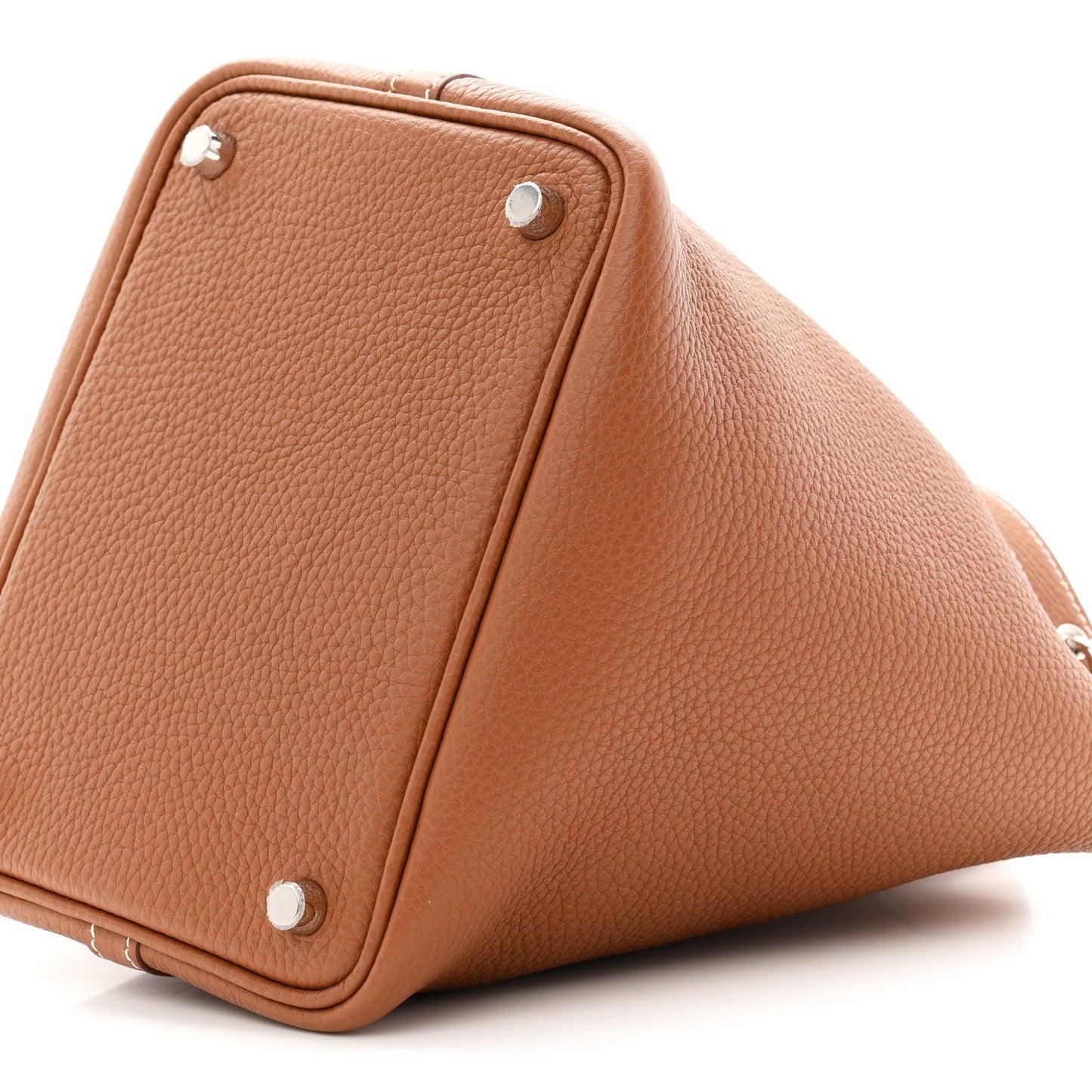 Brown leather bucket tote bag bottom corner with metal snaps and stitched edges