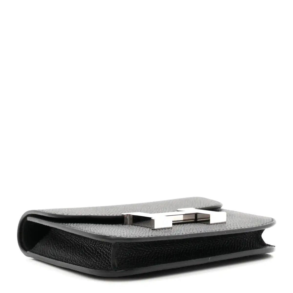 Black slim wallet side view with clasp bar and top edge seam.