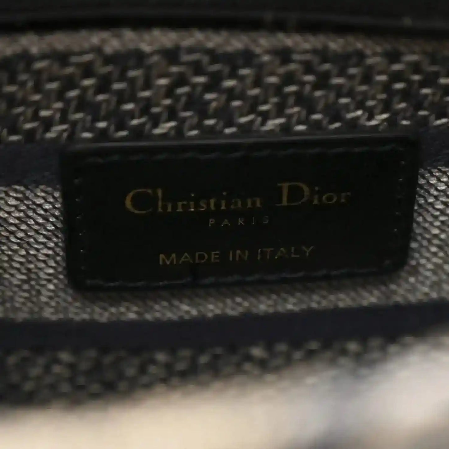 Christian Dior bag interior label reading “Made in Italy”
