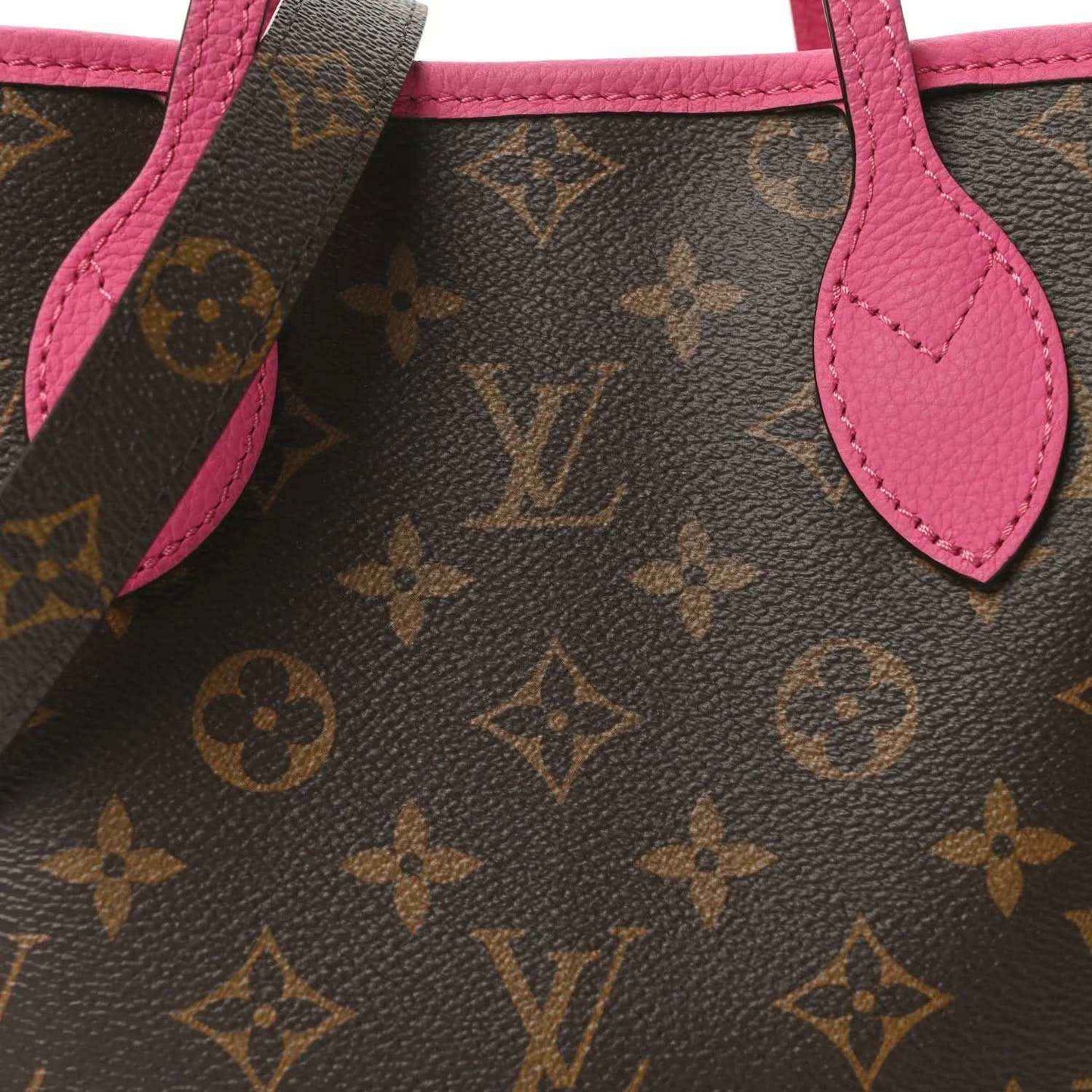 Louis Vuitton monogram tote bag close-up of pink leather handle and strap