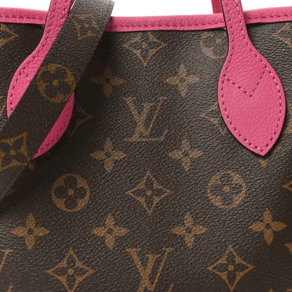 Louis Vuitton monogram tote bag close-up of pink leather handle and strap