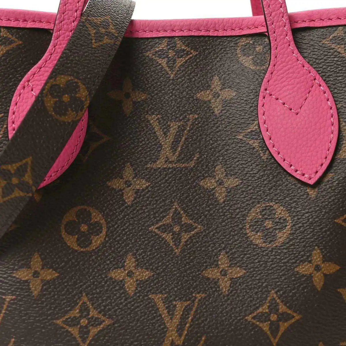 Louis Vuitton monogram tote bag close-up of pink leather handle and strap