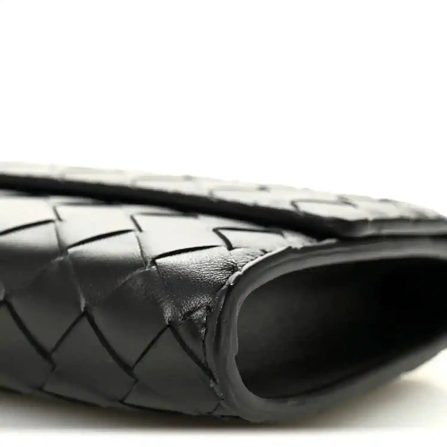 Black woven leather clutch with rounded end and top handle