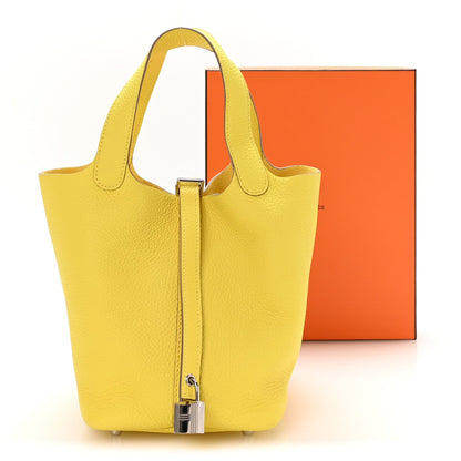 Lime yellow textured leather Picotin-style tote with top handles and lock
