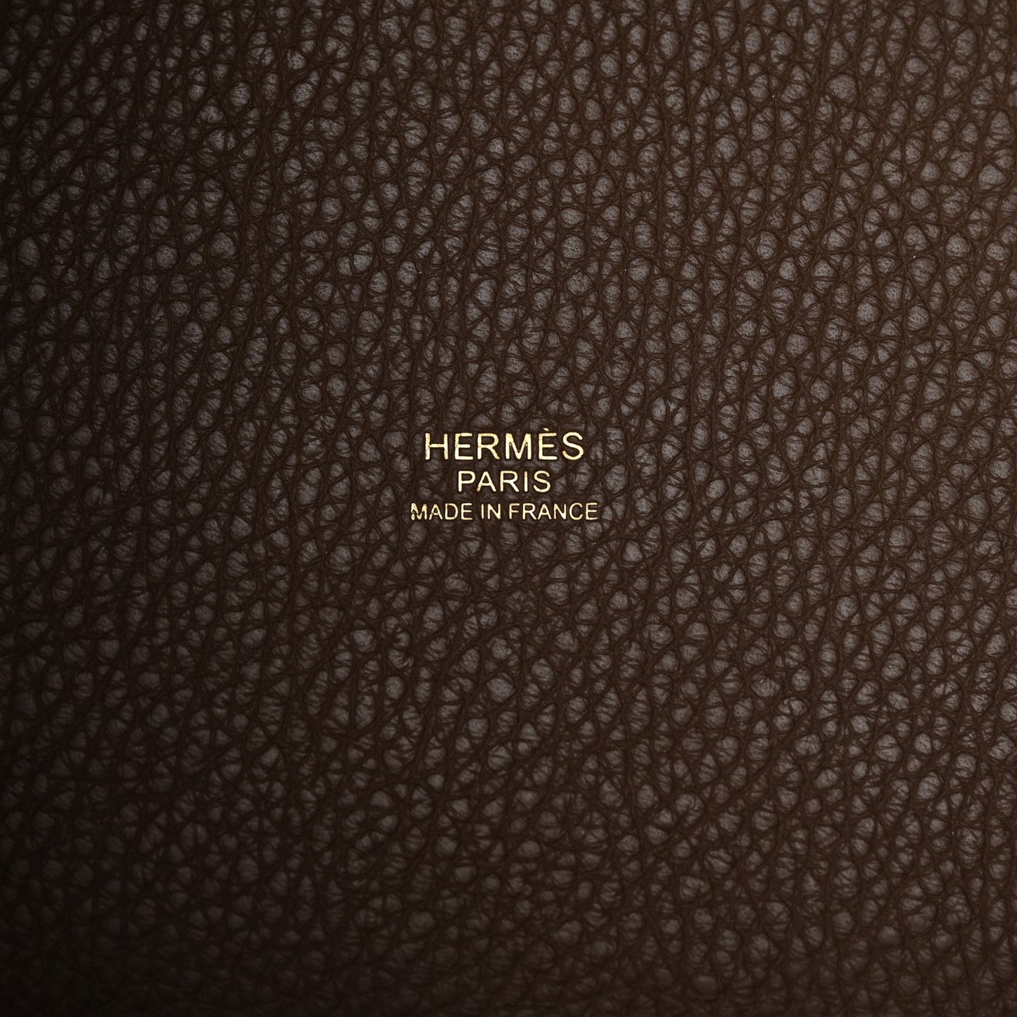 Taupe leather bag panel with Hermes Paris made in France stamp.